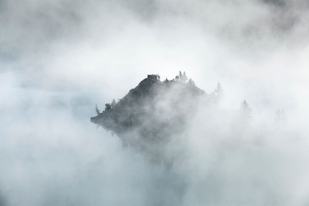 Mountain peak in Emerald Bay peeks through morning mist. Original public domain image from Wikimedia Commons