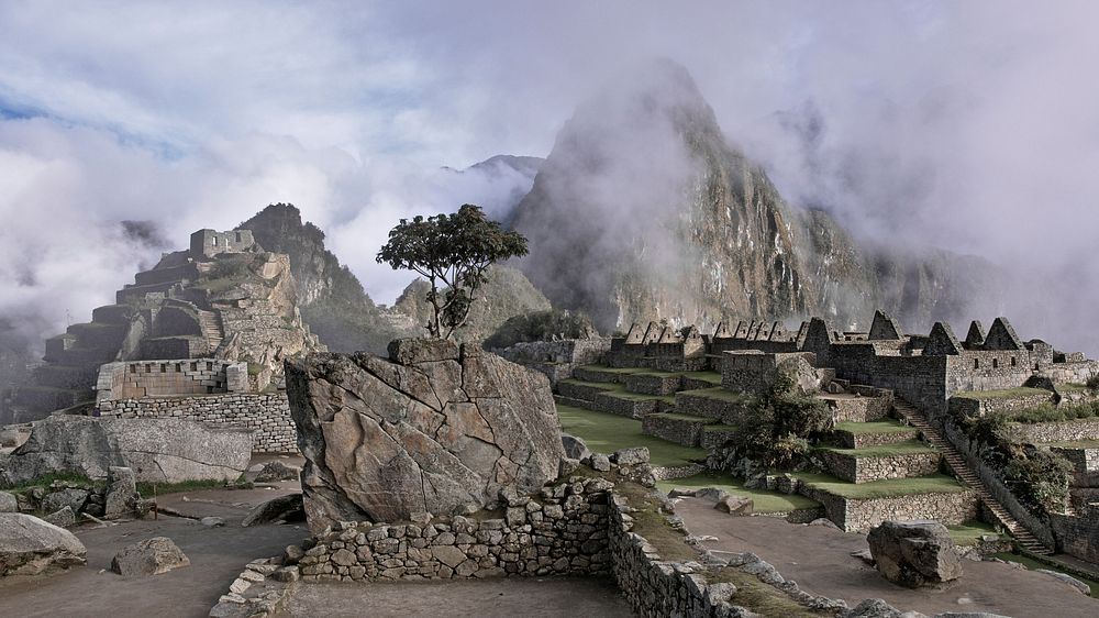 Ruins of the ancient Incan citadel Machu Picchu on a misty morning. Original public domain image from Wikimedia Commons
