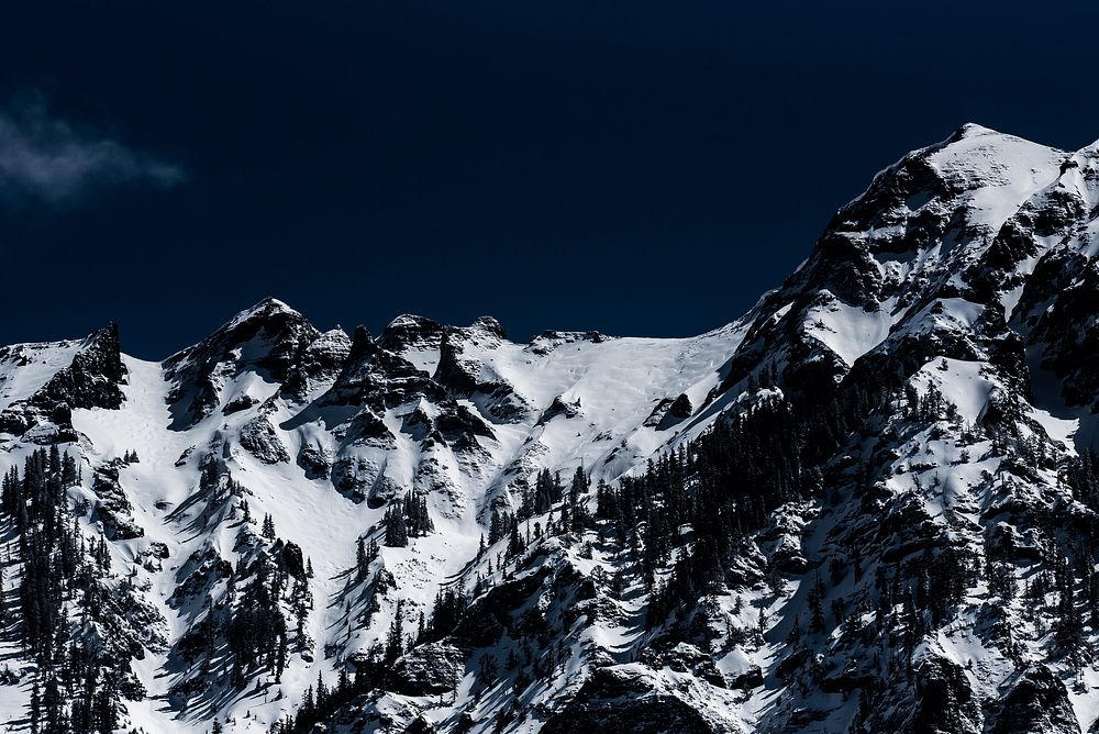 Snow covered mountain against a dark blue sky in Ouray, Colorado. Original public domain image from Wikimedia Commons