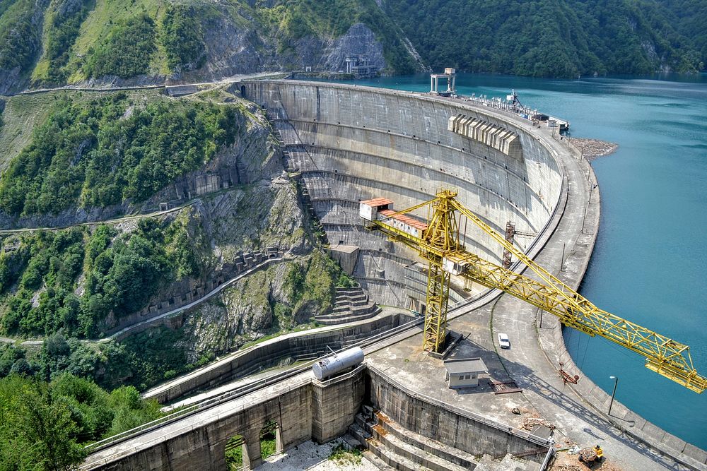 A low crane on a dam on a lake. Original public domain image from Wikimedia Commons