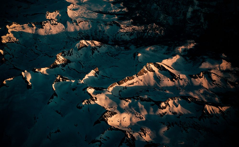 An aerial shot of evening sun dancing on mountain ridges in Yosemite National Park. Original public domain image from…