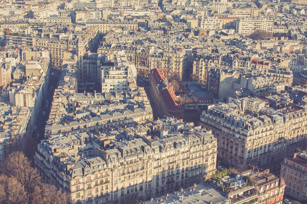 A drone shot of Paris buildings with sepia tone. Original public domain image from Wikimedia Commons