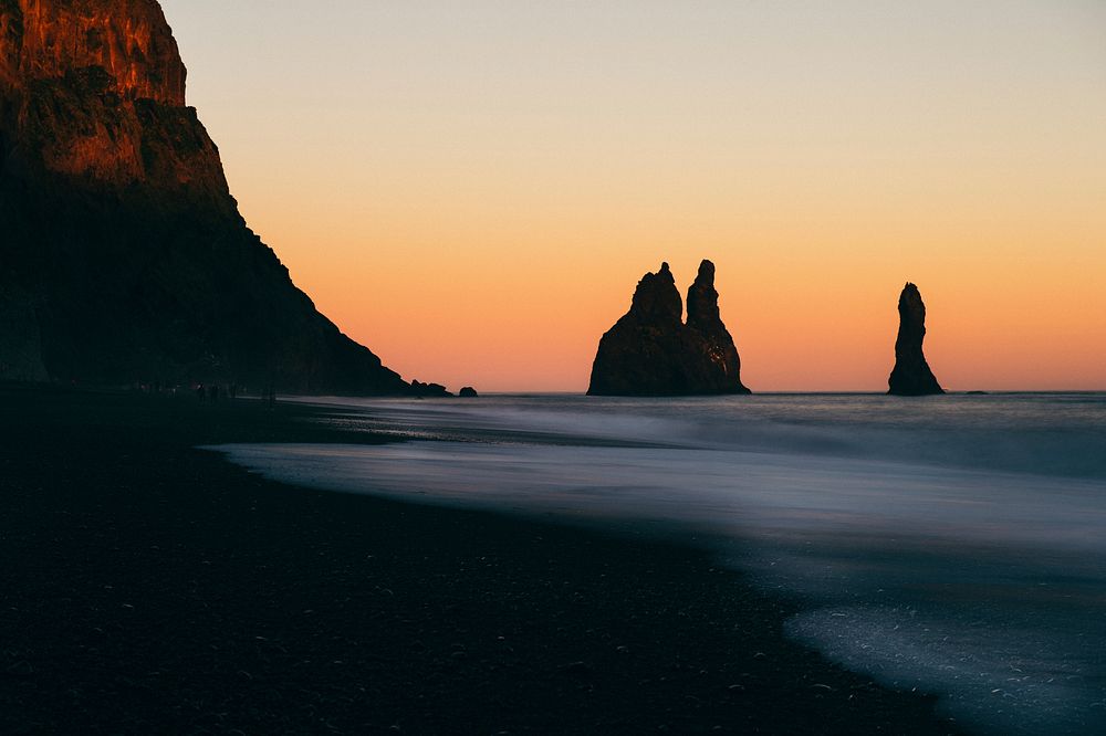 Silhouettes of rock formations in the ocean in Vik. Original public domain image from Wikimedia Commons