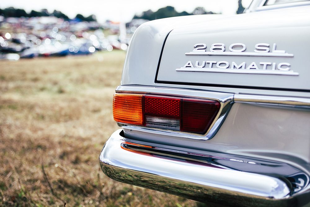 Macro of classic car with tail lights with 280 SL Automatic decals on trunk. Original public domain image from Wikimedia…
