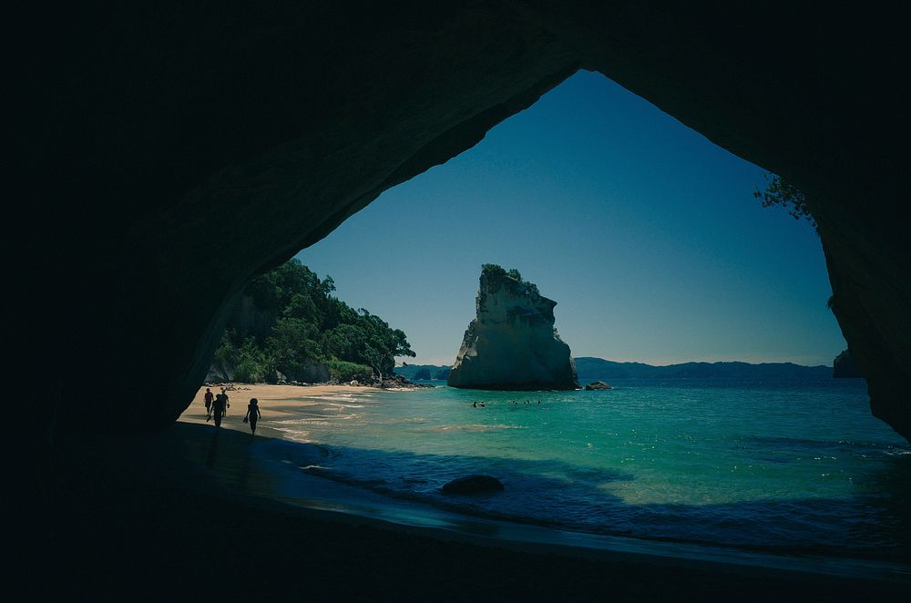 View from a cave on the beach and ocean. Original public domain image from Wikimedia Commons