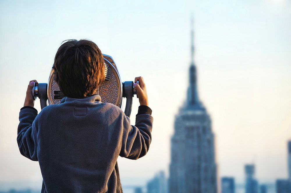 A child looking through a tower viewer in New York. Original public domain image from Wikimedia Commons