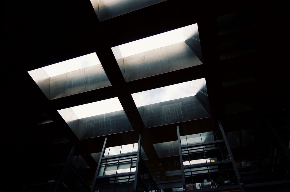 Skylight window from below in dark industrial room at Museo Nacional Centro de Arte Reina Sofía. Original public domain…