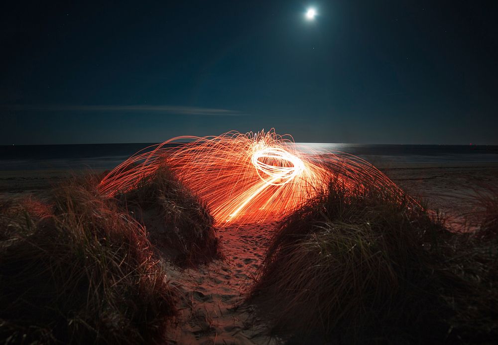 Light show on a beach. Original public domain image from Wikimedia Commons