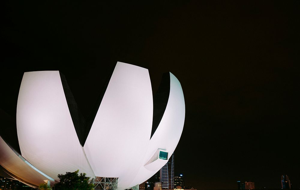 ArtScience Museum architecture at night with city in background. Original public domain image from Wikimedia Commons