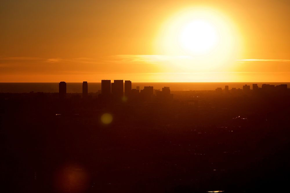 Yellow and gold cityscape sunset from Griffith Observatory.. Original public domain image from Wikimedia Commons