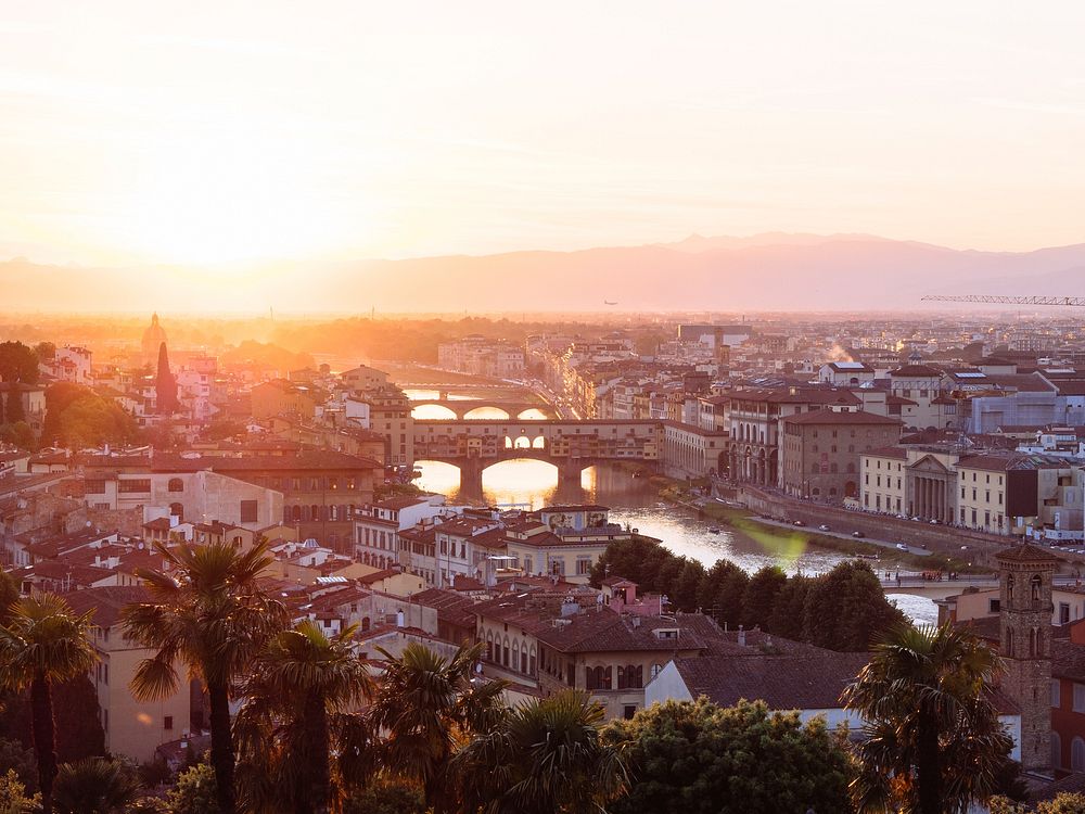 The sun sets over the bridges of the River Arno in the city of Florence, Tuscany, Italy. Original public domain image from…