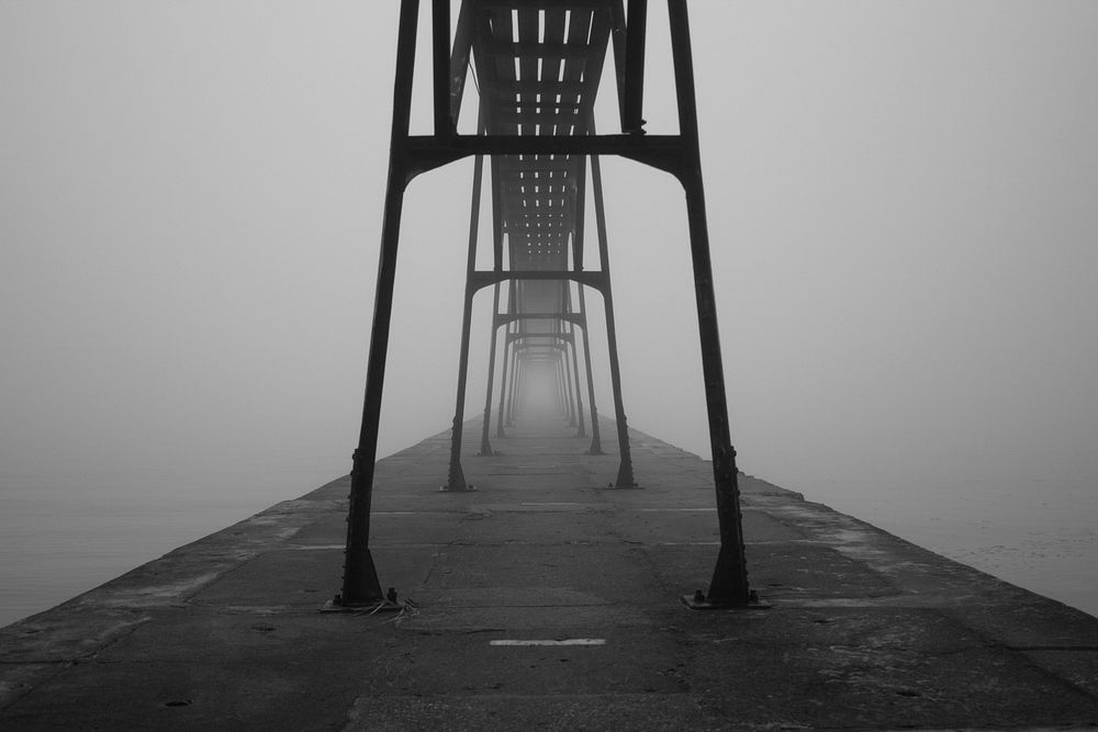 Foggy view of a steel bars on a pier near the ocean. Original public domain image from Wikimedia Commons
