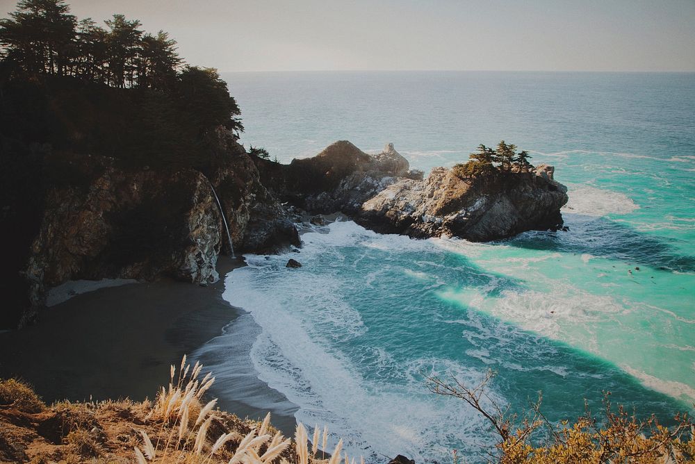 View of an ocean bay from a cliff at McWay Falls. Original public domain image from Wikimedia Commons