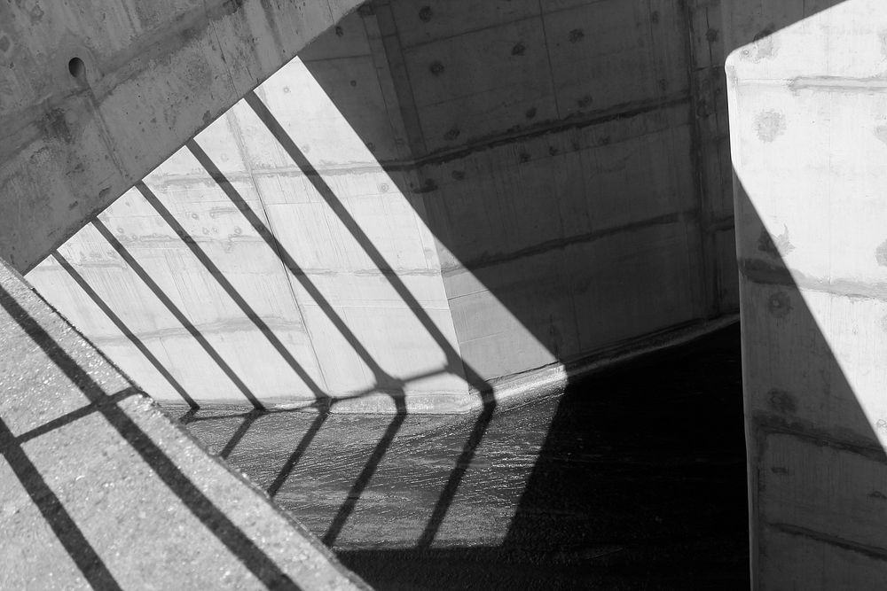 Black and white shot of concrete wall with shadow in Óbidos. Original public domain image from Wikimedia Commons