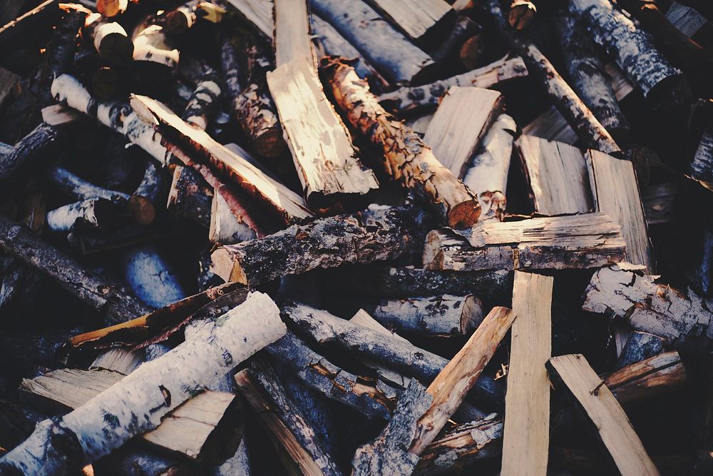 An untidy heap of firewood. Original public domain image from Wikimedia Commons