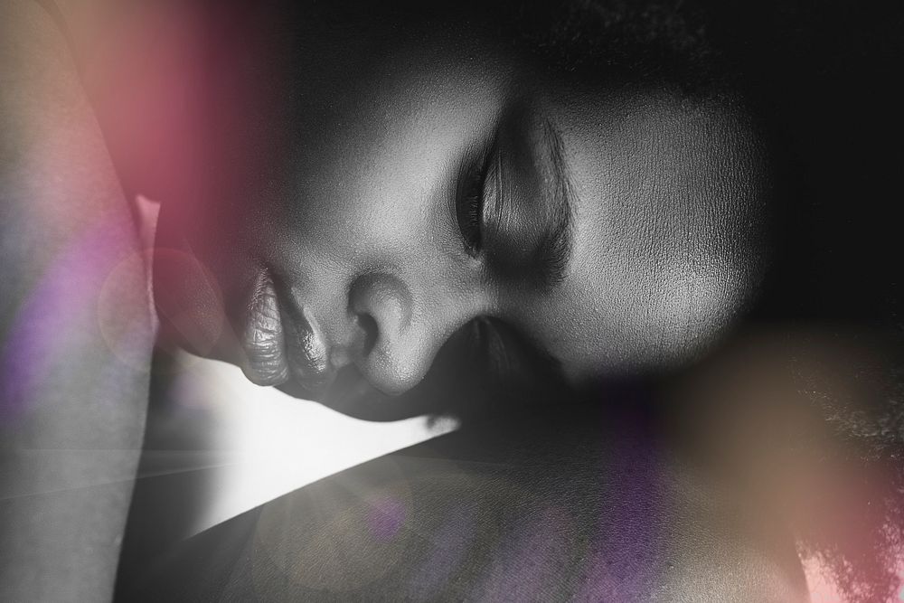 Purple lens flare on an African woman background image