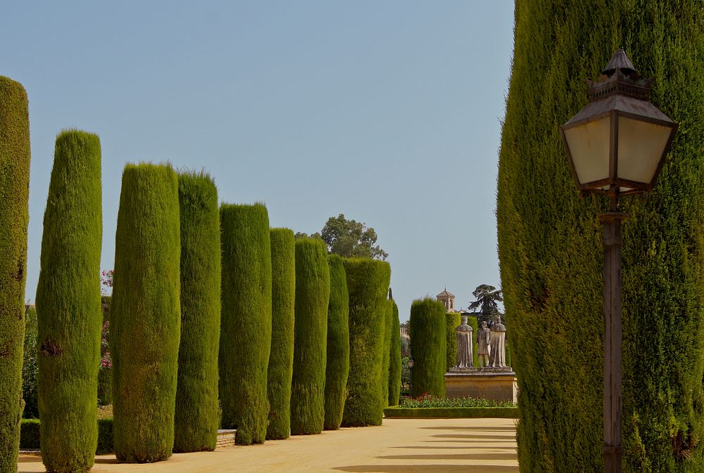 In the Gardens of the "Alcazar de los Reyes Cristianos" in Cordoba, Spain. In background, statues of Christopher Columbus…