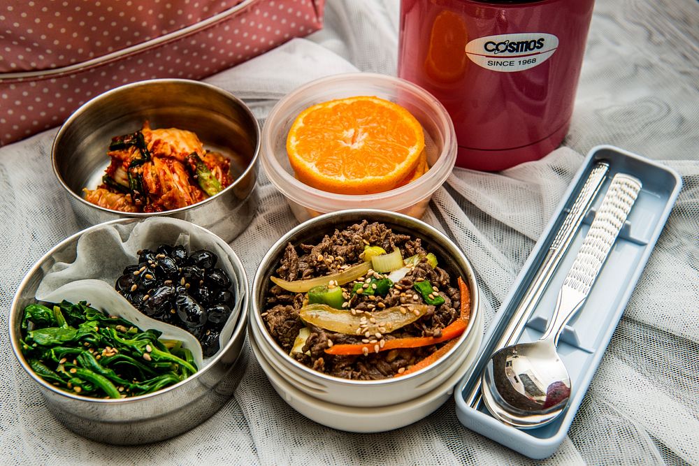 Lentil and Roasted Veggie Bowl with side dishes served separately in lunch box 