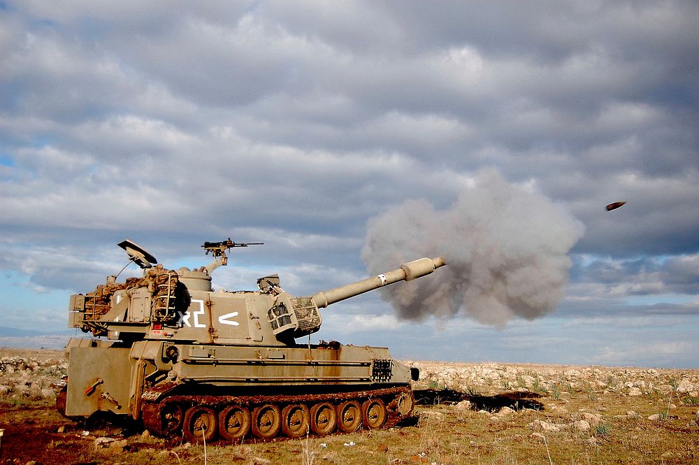 a cannon firing - M109 self-propelled howitzer. Original public domain image from Wikimedia Commons