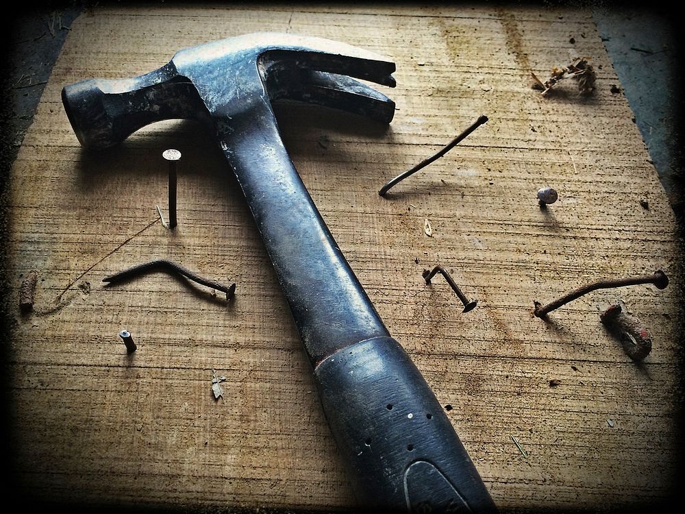 Hammer and bent nails. Original public domain image from Wikimedia Commons