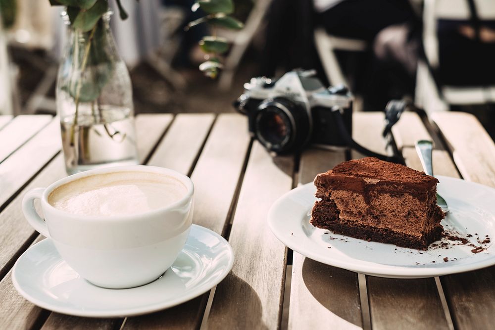 A slice of chocolate cake and a cup of coffee. Original public domain image from Wikimedia Commons