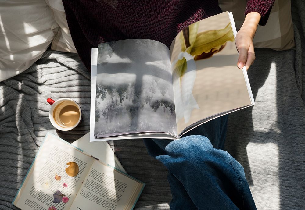 Woman reading magazine with coffee cup