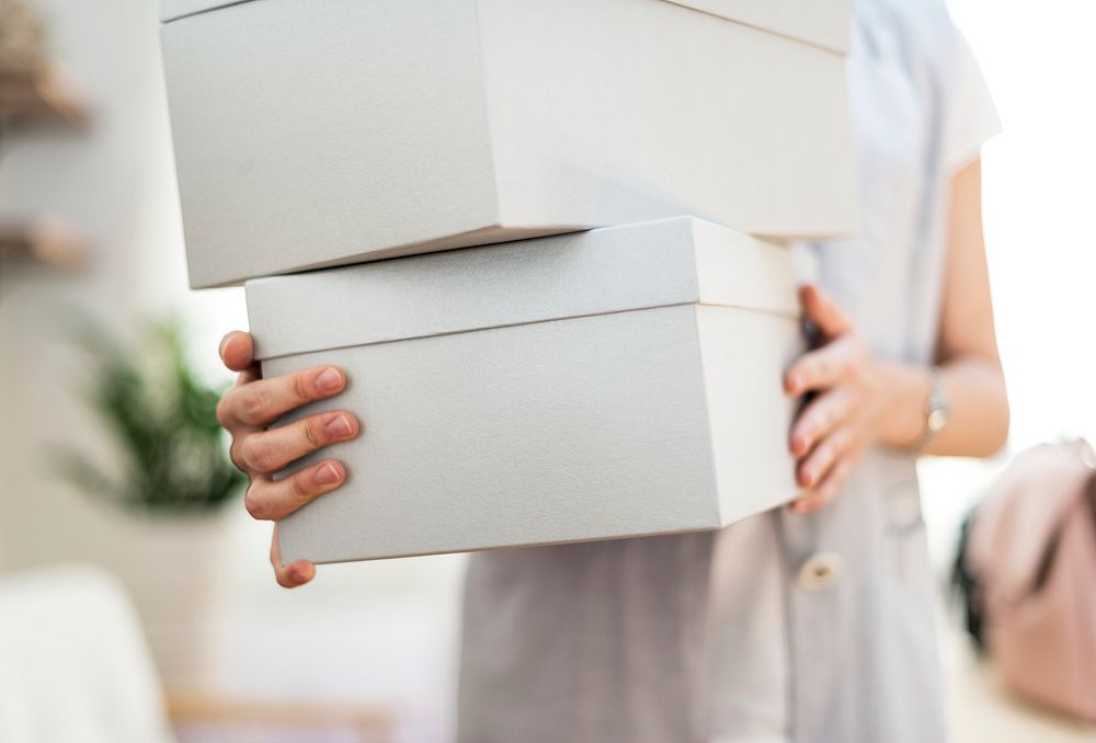 Woman carrying shoes boxes