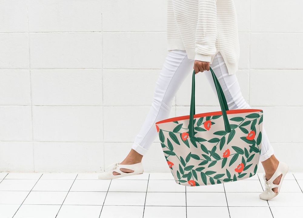 Leafy tote bag mockup, walking woman, editable design psd