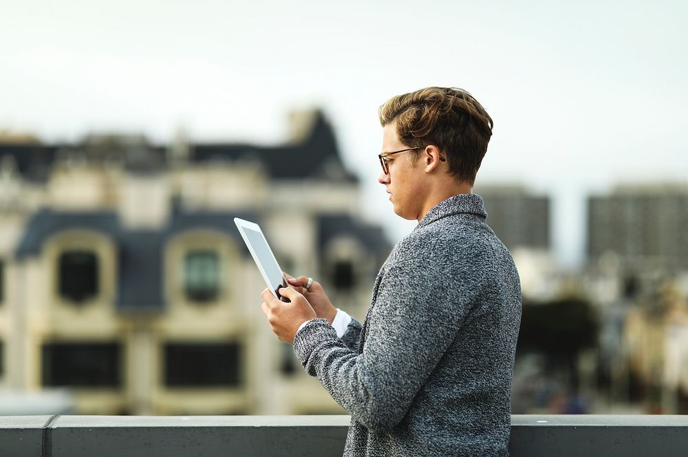 Man using a digital tablet at a rooftop in San Francisco