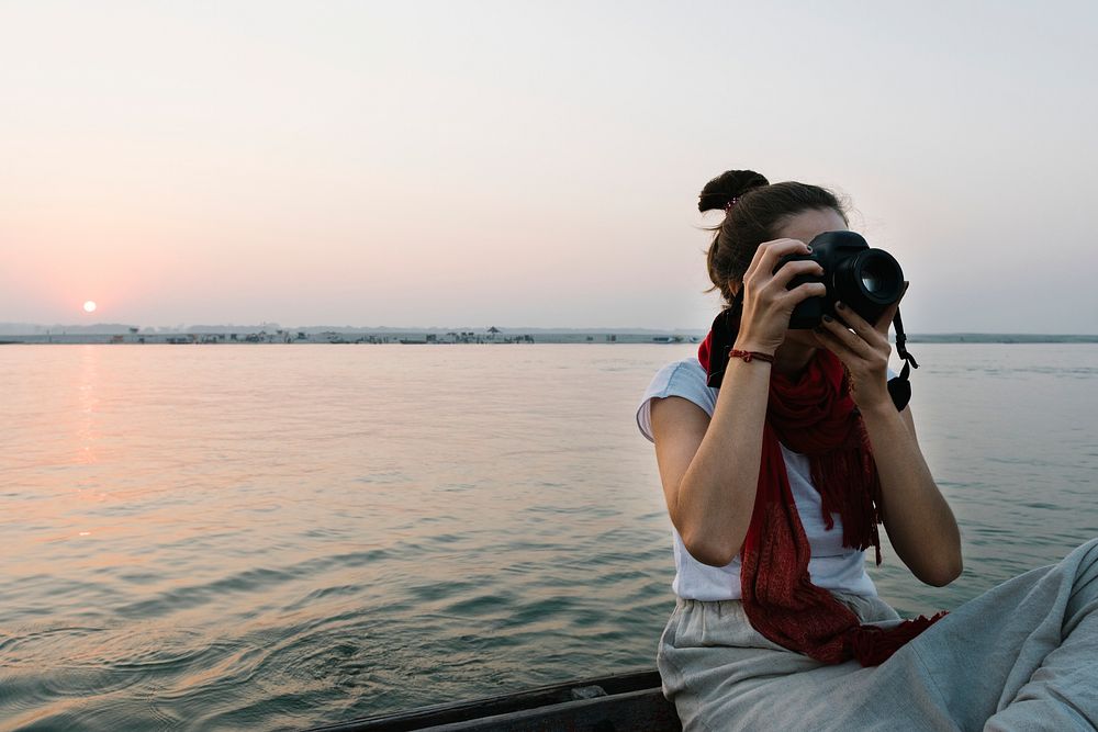 Female photographer sitting on a boat | Free Photo - rawpixel