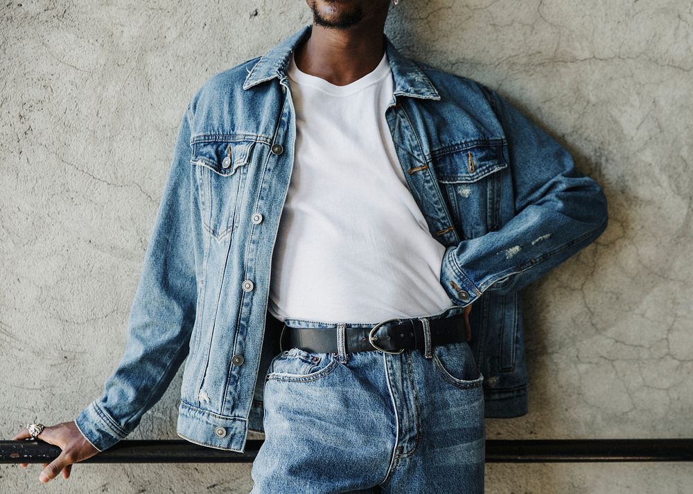 Black man wearing a silk screen white t-shirt