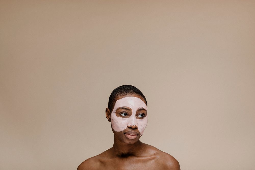Black woman doing a face mask