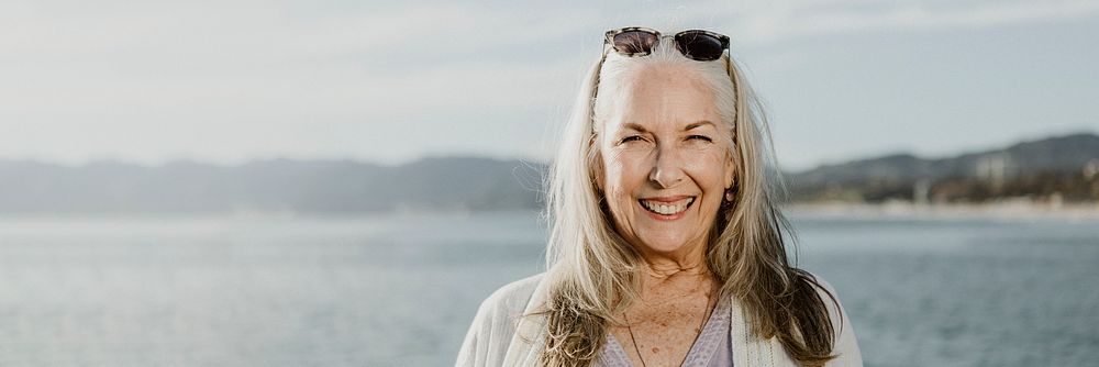 Happy senior woman by the sea