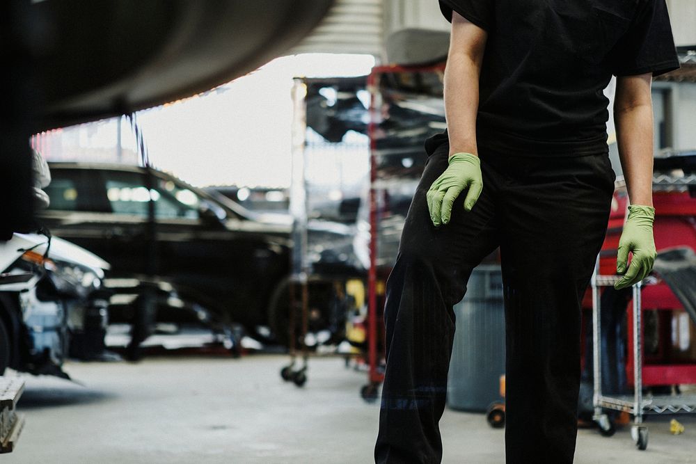 Female mechanic working in the garage