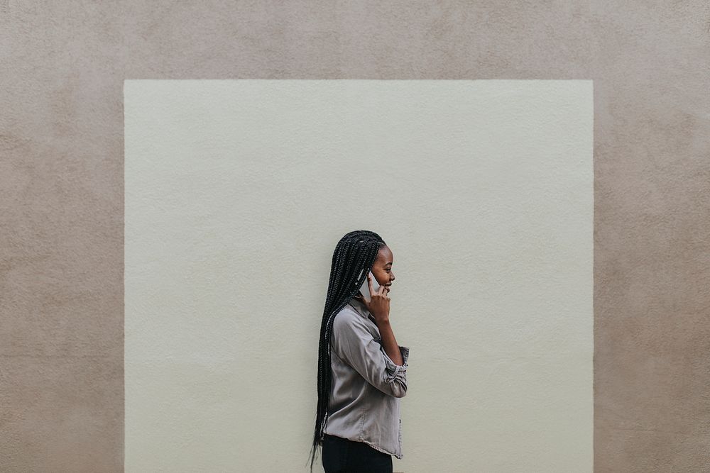 Happy black woman speaking on the phone