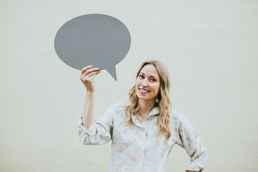 Woman showing a blank speech bubble