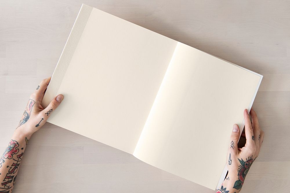 Tattooed woman reading a book