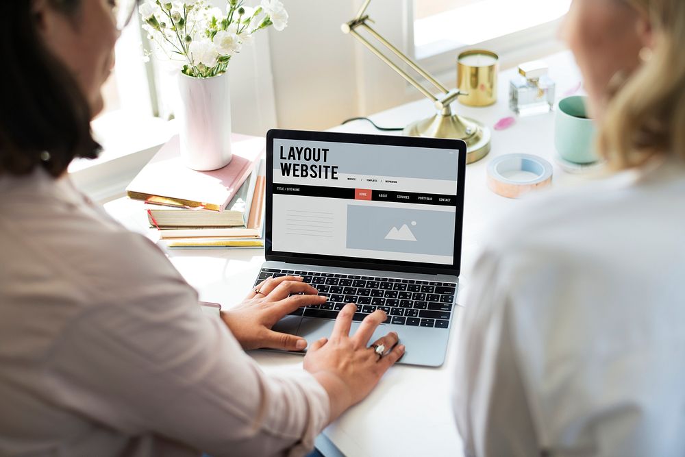 Woman using a laptop in a business meeting