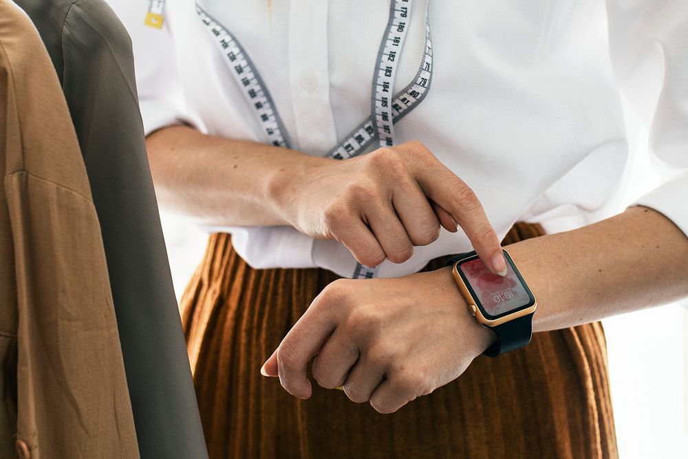 Designer using a digital smartwatch