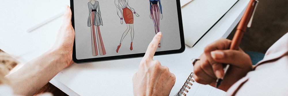 Fashion designer working on their design on a digital tablet