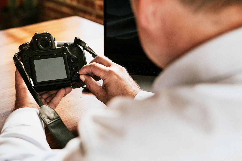 Photographer using a camera in a studio