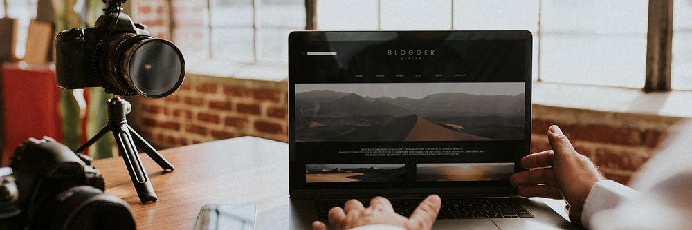 Blogger filming himself while using a laptop mockup