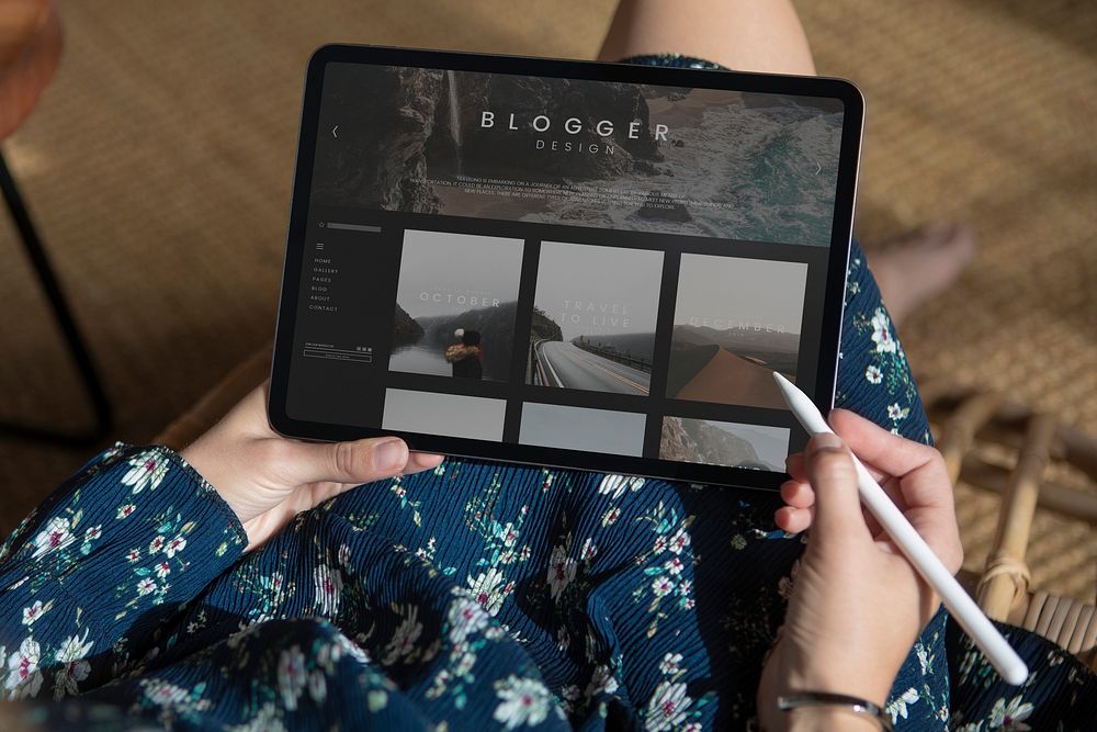 Woman blogging on a digital tablet