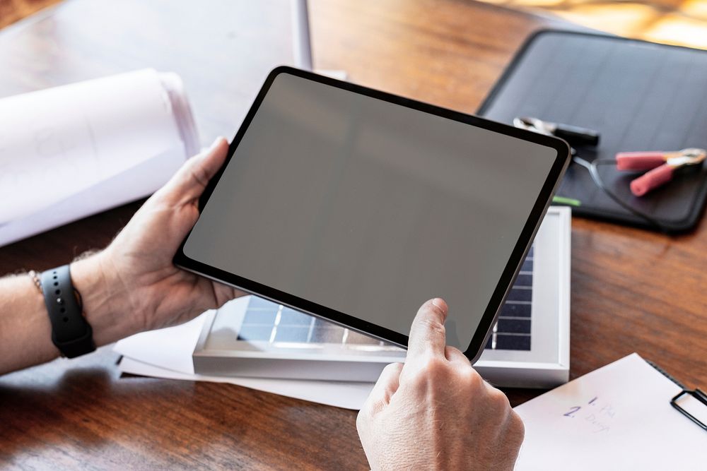 Eco-friendly engineer using a digital tablet