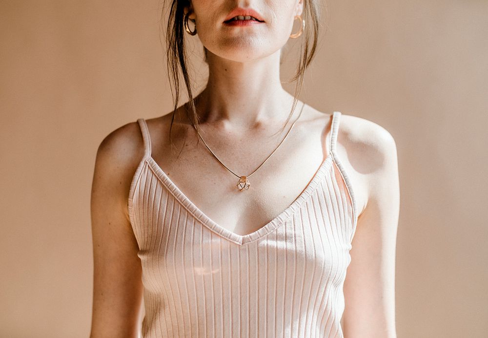 Woman in a light pink tank top