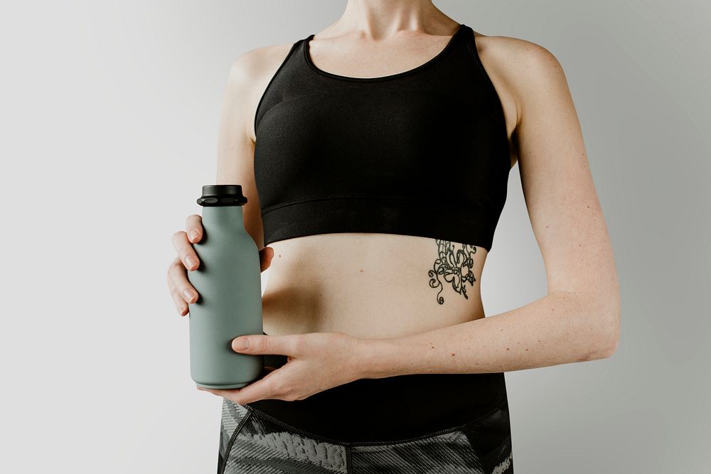 Sportive woman with a water bottle