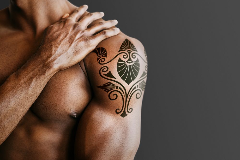 Muscular man with a tattoo on his arm