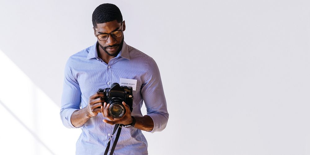 Black photographer using a retro film camera social template