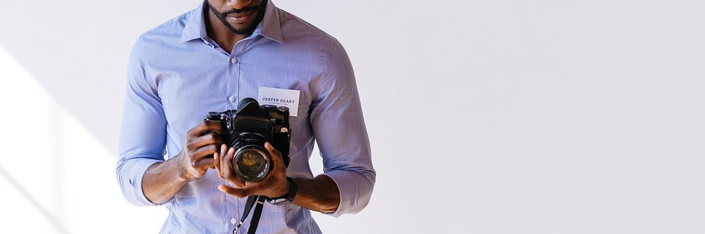 Black photographer using a retro film camera social template