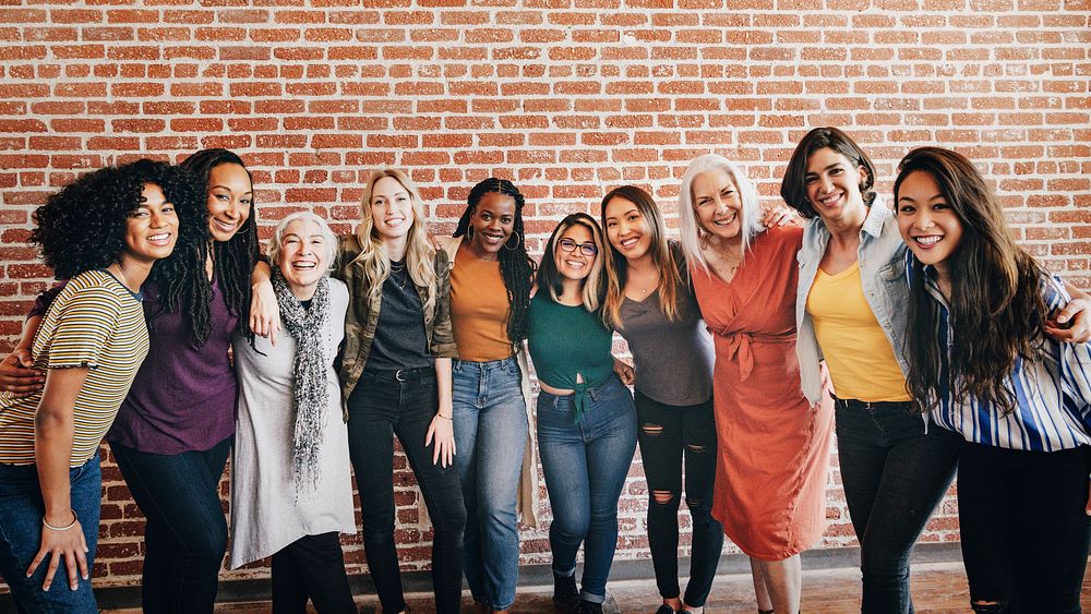 Diverse women standing together background